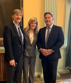 Senator Montigny (right) and Jim Jensvold and Dr. Jennifer Conrad of the Paw Project